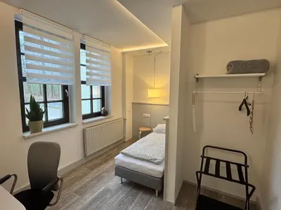Ein Bett oder Betten in einem Zimmer der Unterkunft Landgasthof & Hotel Waldeck