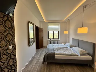 Ein Bett oder Betten in einem Zimmer der Unterkunft Landgasthof & Hotel Waldeck