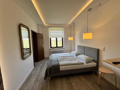 Ein Bett oder Betten in einem Zimmer der Unterkunft Landgasthof & Hotel Waldeck