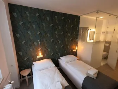 Ein Bett oder Betten in einem Zimmer der Unterkunft Landgasthof & Hotel Waldeck