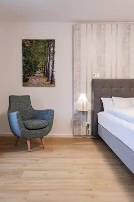 Ein Bett oder Betten in einem Zimmer der Unterkunft ALEXBAD Ferienwohnungen