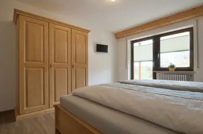 Ein Bett oder Betten in einem Zimmer der Unterkunft Ferienwohnung Kobelsberg