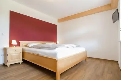Ein Bett oder Betten in einem Zimmer der Unterkunft Ferienwohnung Kobelsberg