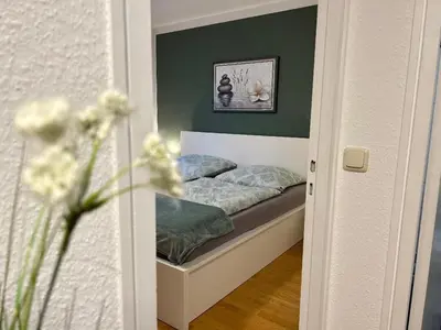 Ein Bett oder Betten in einem Zimmer der Unterkunft Gemütliches helles Apartment mit Balkon und Parkplatz vor der Tür im Zentrum von Bayreuth