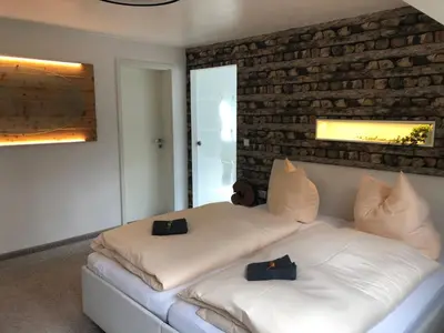 Ein Bett oder Betten in einem Zimmer der Unterkunft Ferienwohnung Parkblick