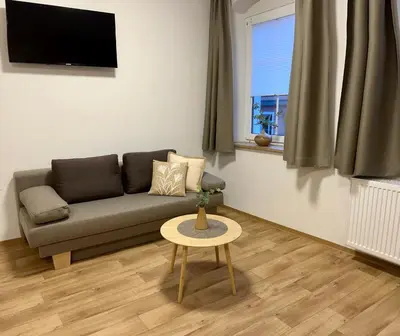 Ein Sitzbereich in der Unterkunft ANNA Gästehaus Zimmer