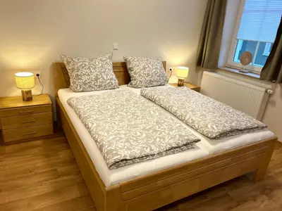 Ein Bett oder Betten in einem Zimmer der Unterkunft ANNA Gästehaus Zimmer