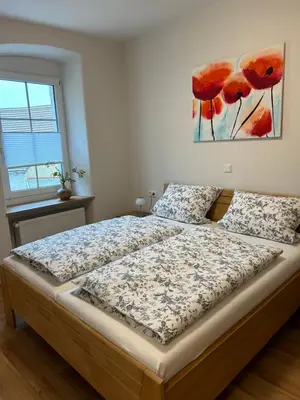 Ein Bett oder Betten in einem Zimmer der Unterkunft ANNA Gästehaus Zimmer