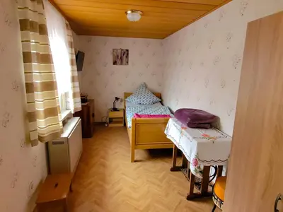 Ein Bett oder Betten in einem Zimmer der Unterkunft FeWo Ulbrich Langenstadt