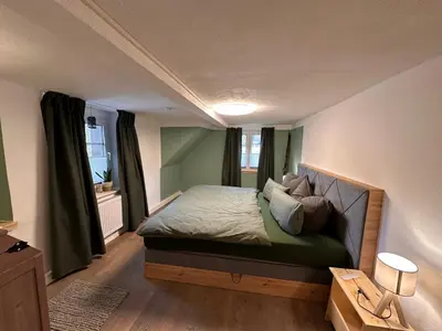 Ein Bett oder Betten in einem Zimmer der Unterkunft Ferienhaus Hemann mit eigener Sauna