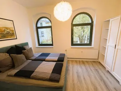 Ein Bett oder Betten in einem Zimmer der Unterkunft 59m² Ferienwohnung 