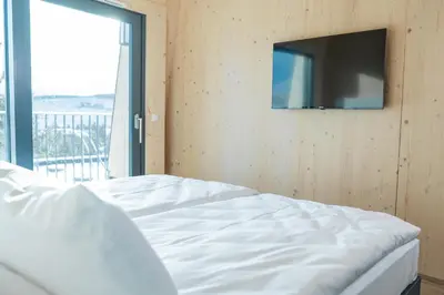 Ein Bett oder Betten in einem Zimmer der Unterkunft Summit of Saxony Resort Oberwiesenthal