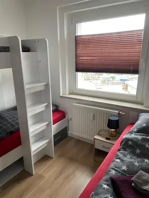 Ein Bett oder Betten in einem Zimmer der Unterkunft FeWo WIEKO Plauen Leibnizstr. H3, 3.OG links