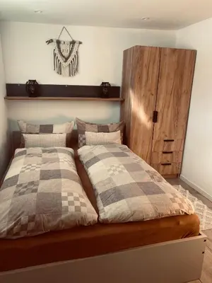Ein Bett oder Betten in einem Zimmer der Unterkunft Ferienwohnung Leadro