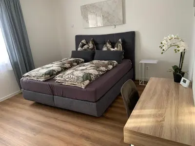 Ein Bett oder Betten in einem Zimmer der Unterkunft Außergewöhnliche Ferienwohnung in modernen Styl