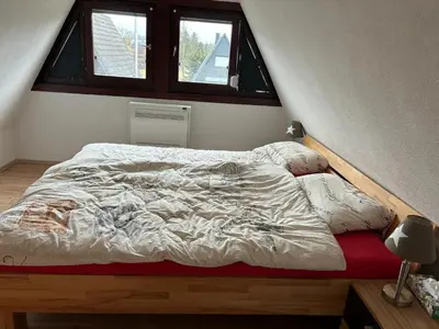 Ein Bett oder Betten in einem Zimmer der Unterkunft FichtelOase