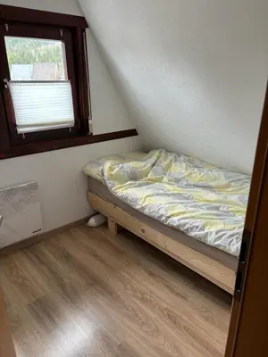 Ein Bett oder Betten in einem Zimmer der Unterkunft FichtelOase