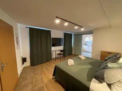 Ein Bett oder Betten in einem Zimmer der Unterkunft Apartment Violine1 am Bahnhof-City