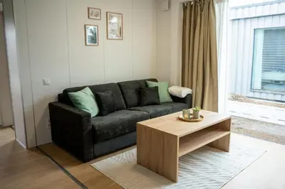 Ein Sitzbereich in der Unterkunft Hotel & Chalets by Revex