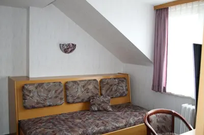 Ein Bett oder Betten in einem Zimmer der Unterkunft Pension Erholung