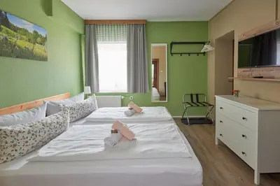 Ein Bett oder Betten in einem Zimmer der Unterkunft Gasthaus Stollmühle
