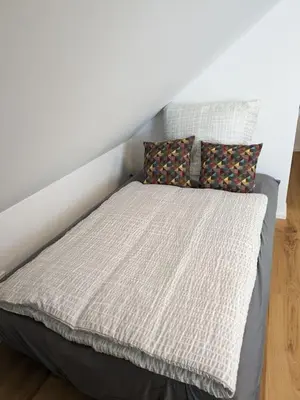 Ein Bett oder Betten in einem Zimmer der Unterkunft Suite 13 im Wald mit Balkon