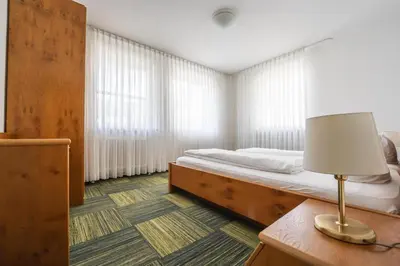 Ein Bett oder Betten in einem Zimmer der Unterkunft Gut Matheshof Apartments