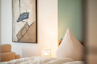 Ein Bett oder Betten in einem Zimmer der Unterkunft bayreuthome - Ambiente-Apartment im Gassenviertel