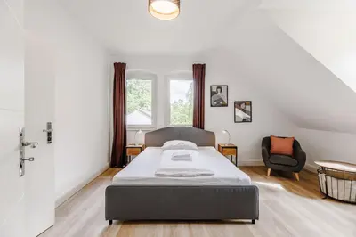 Ein Bett oder Betten in einem Zimmer der Unterkunft Villa Plassenburg