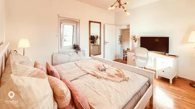 Ein Bett oder Betten in einem Zimmer der Unterkunft Zentrales Turm-Apt mit Terrasse