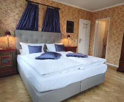 Ein Bett oder Betten in einem Zimmer der Unterkunft Hotel Goldener Anker