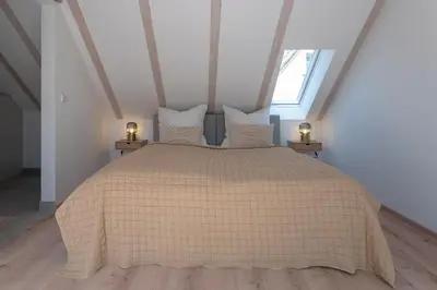 Ein Bett oder Betten in einem Zimmer der Unterkunft Ferienwohnungen im Herzen der Stadt