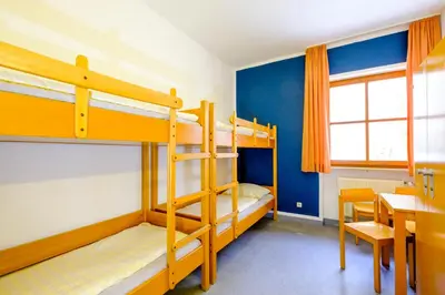 Ein Bett oder Betten in einem Zimmer der Unterkunft Jugendherberge Falkenberg