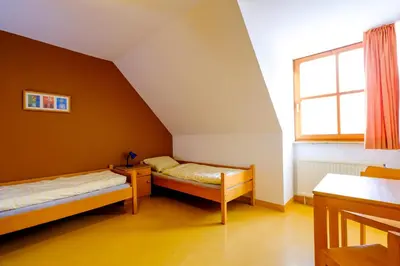 Ein Bett oder Betten in einem Zimmer der Unterkunft Jugendherberge Falkenberg