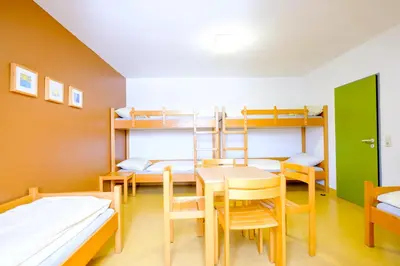 Ein Bett oder Betten in einem Zimmer der Unterkunft Jugendherberge Falkenberg