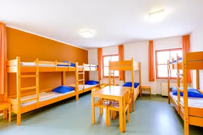 Ein Bett oder Betten in einem Zimmer der Unterkunft Jugendherberge Falkenberg