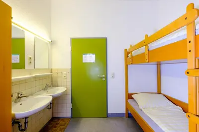 Ein Bett oder Betten in einem Zimmer der Unterkunft Jugendherberge Falkenberg