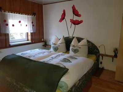 Ein Bett oder Betten in einem Zimmer der Unterkunft Ferienwohnung Grenzblick