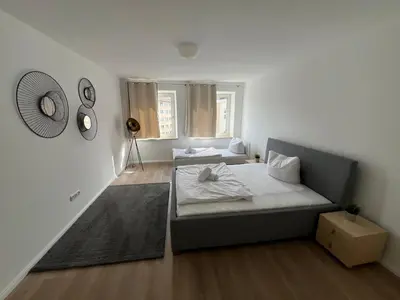 Ein Bett oder Betten in einem Zimmer der Unterkunft Zentrale Apartments in Bayreuth