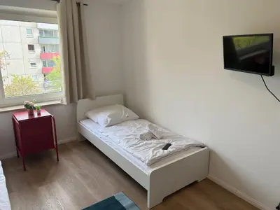 Ein Bett oder Betten in einem Zimmer der Unterkunft Zentrale Apartments in Bayreuth