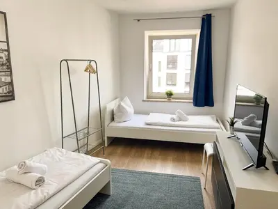 Ein Bett oder Betten in einem Zimmer der Unterkunft Zentrale Apartments in Bayreuth
