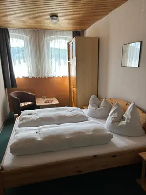 Ein Bett oder Betten in einem Zimmer der Unterkunft Goldener Loewe