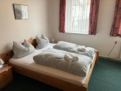 Ein Bett oder Betten in einem Zimmer der Unterkunft Goldener Loewe
