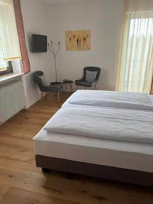 Ein Bett oder Betten in einem Zimmer der Unterkunft Gasthof zur Burgruine