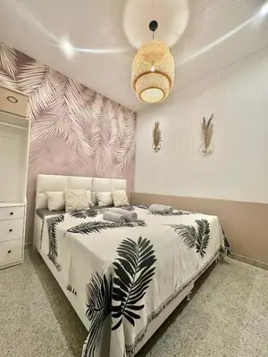 Ein Bett oder Betten in einem Zimmer der Unterkunft Ferienwohnung Lauri