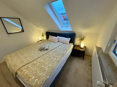 Ein Bett oder Betten in einem Zimmer der Unterkunft aus-ZEIT Apartments