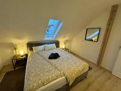 Ein Bett oder Betten in einem Zimmer der Unterkunft aus-ZEIT Apartments