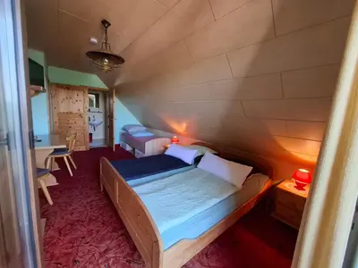 Ein Bett oder Betten in einem Zimmer der Unterkunft Pension Hubertushöhe