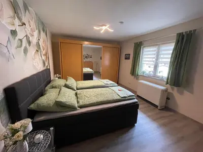 Ein Bett oder Betten in einem Zimmer der Unterkunft Ferienwohnung Emma