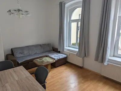 Ein Sitzbereich in der Unterkunft Ferienwohnung zum Schloss